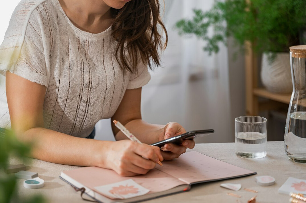 person setting goals on paper