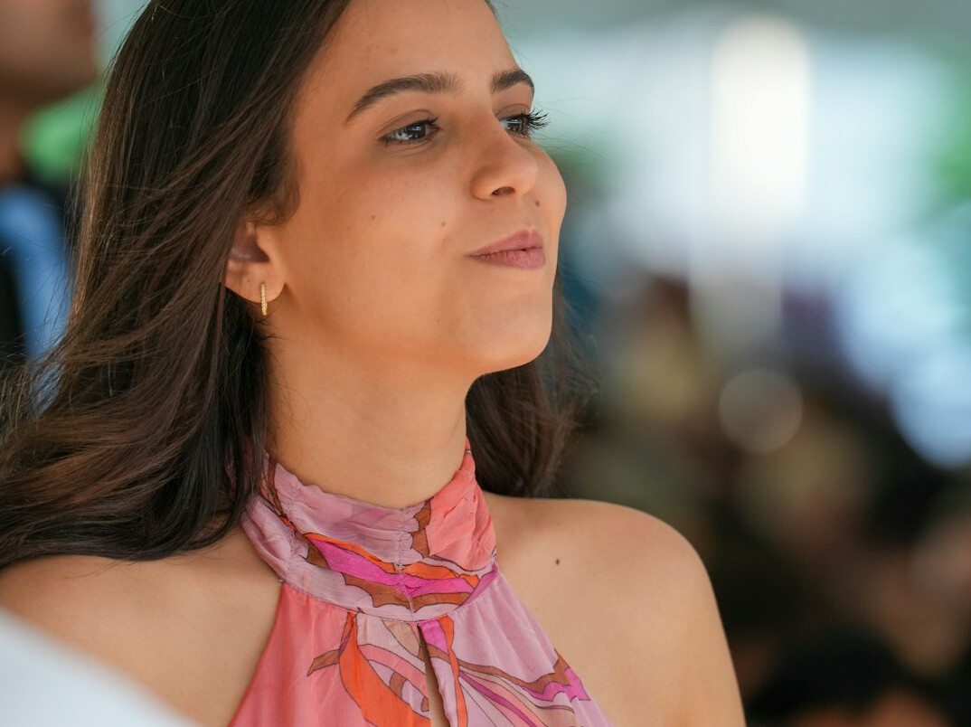 Brazilian woman confidently speaking during a presentation