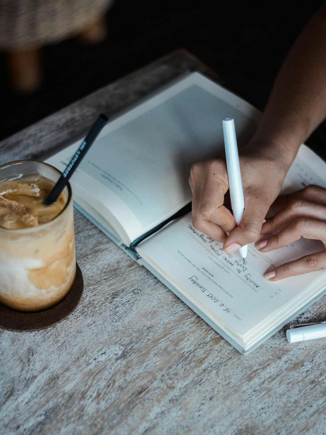 person journaling goals