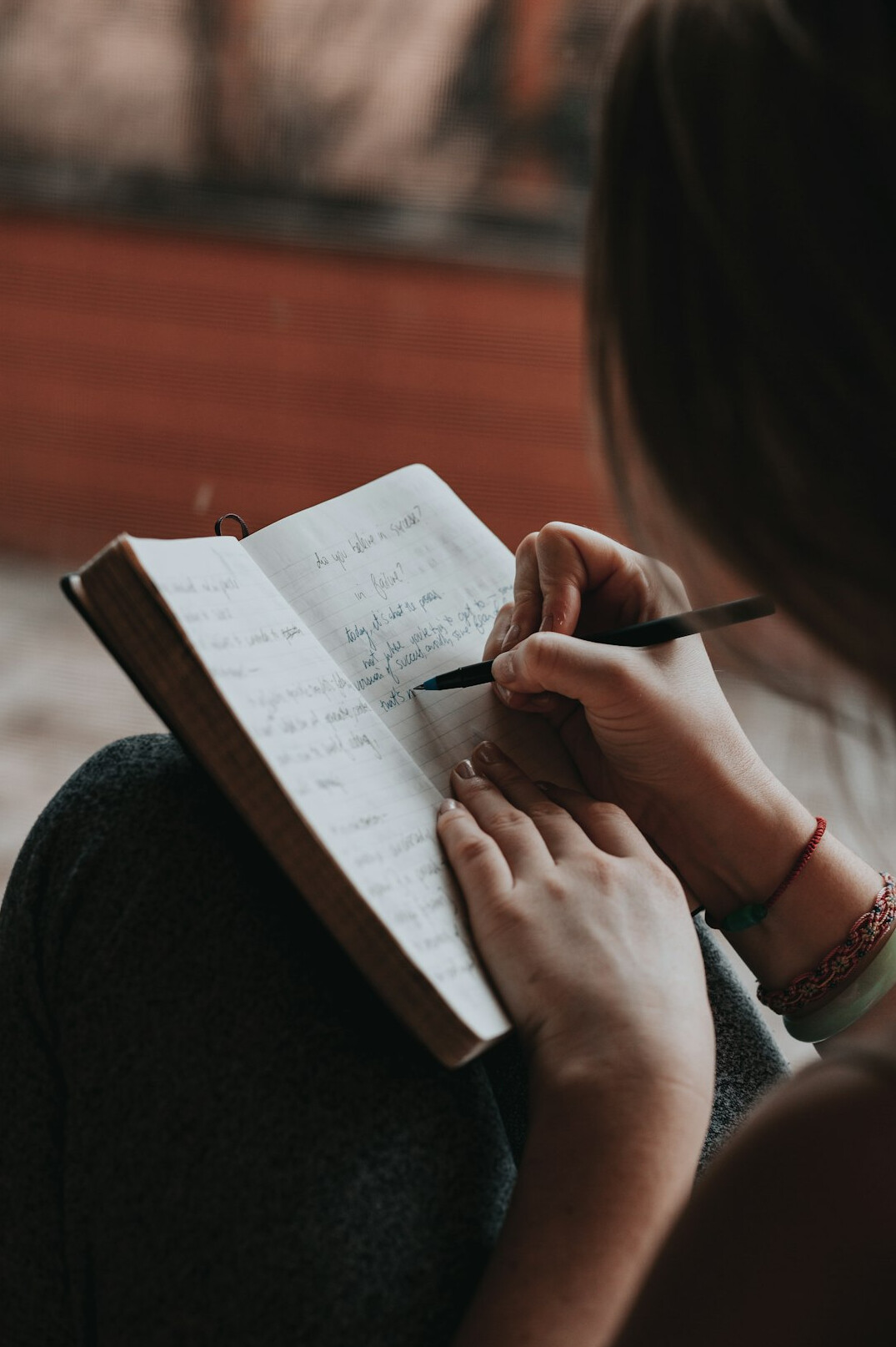 person writing notes